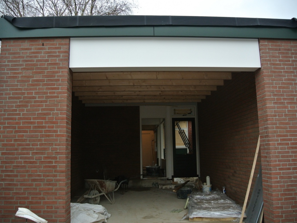 Aanbouw met badkamer, studio en garage