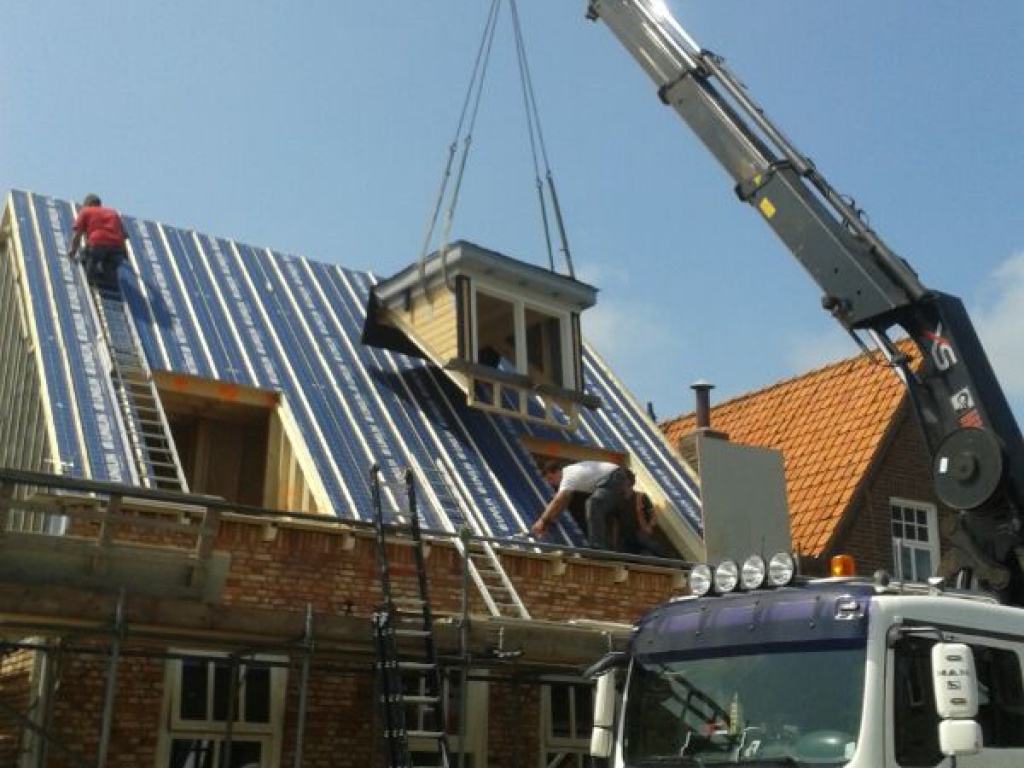 Verbouwen woning, realiseren bovenverdieping met dakkapellen en voegwerk